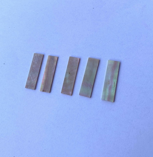 Awabi flat inlay blanks 12 x 35 x 1.5mm Good on at least 1 side. Reverse side may contain some shell skin or worm damage. uses include Awabi (Goldfish) bow slides for bass and viola.