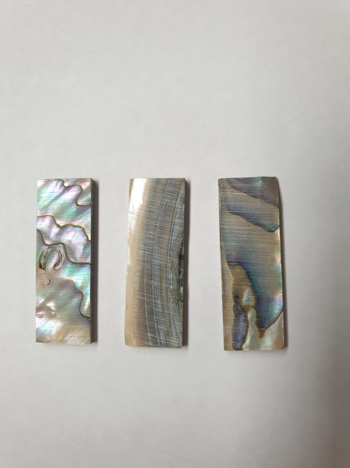Green abalone (Mexican green abalone) flat inlay blanks size 12mm (0.47") width x 35mm (1.38") length x 2mm (0.079") thickness B grade good on at least 1 side - may have some shell skin, corners may be chipped or worm damage on 1 side.