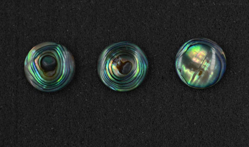 Paua domed finger button inlay 14.22mm (0.56") diameter 2.3mm (0.09") thickness domed and polished on 1 side round pcs Ideal for use in brasswind or woodwind instruments as well as accordions and general inlay or jewellery decorations. All pcs are A grade.