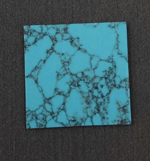 Arizona Turquoise K02  reconstituted stone blanks 50 x 50 x 1.7mm suitable for inlay and other decorations. Can be cut with standard cutting tools - jewellery saw similar in characteristics to mother of pearl (hardness approx. 3. Can be sanded and polished same way as shell material. All pcs are A grade good on both sides.