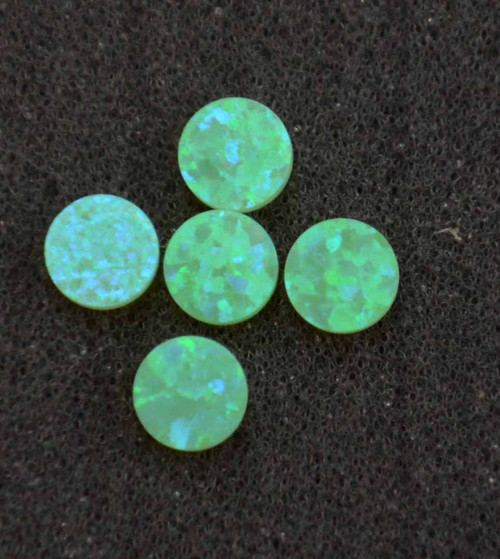 Opal dots OP56 7 x 1.3mm flat pcs made to specific diameter and thickness made from manufactured opal suitable for inlay, fingerboard markers, jewellery, Opal dots can be worked same way as mother of pearl and are of similar hardness.