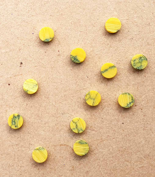 Yellow stone reconsituted stone dots 2.5 x 1.5mm - round flat pcs cut to precise diameter and thickness. Ideal for use in inlay applications - for fretboard markers, and general inlay or jewellery decorations. All dots are A grade good on both sides.
