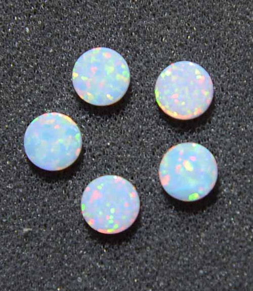Opal dots OP17 14 x 2.5mm flat pcs made to specific diameter and thickness made from manufactured opal suitable for inlay, fretboard markers, jewellery, Opal dots can be worked same way as mother of pearl and are of similar hardness.