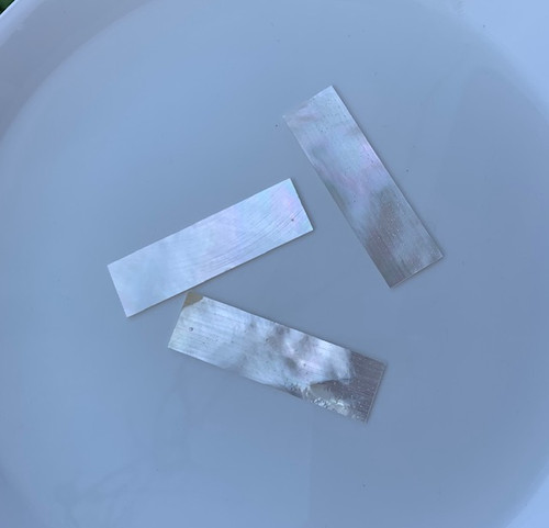 White Mother of Pearl flat inlay blanks size 25.4mm (10.3") width x 63.5mm (2.59") length x 2mm (0.08") thickness B grade clean on both sides may have some internal cracks.
