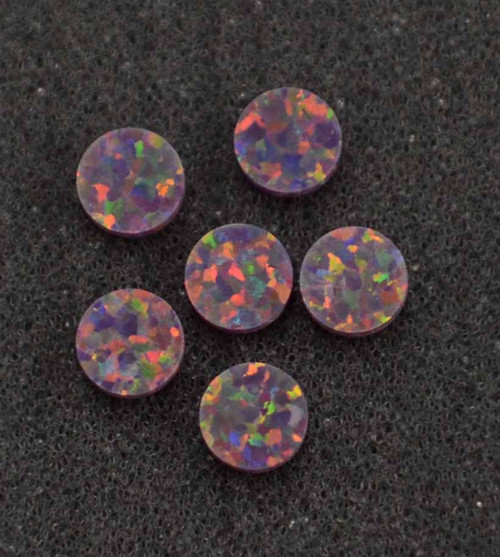 Opal dots OP76 10 x 1.3mm flat pcs made to specific diameter and thickness made from manufactured opal suitable for inlay, fretboard markers, jewellery, Opal dots can be worked same way as mother of pearl and are of similar hardness.