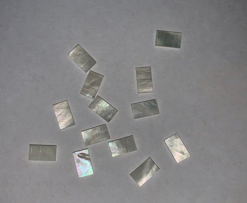 White Mother of Pearl flat inlay blanks size 5mm (0.2") width x 9.5mm (0.37") length x 1mm (0.04") thickness. A grade good on both sides.