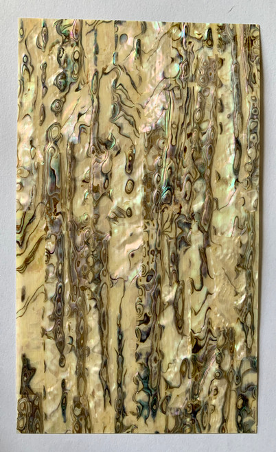 sheet has shell throughout consisting of layers of smaller shell pcs. Sheet size 135 x 235mm (5.3 x 9.3"). Thickness 0.5mm  (0.02") Ideal for inlay work, marquetry, jewellery, knife handles. Economical and easy to cut. All layers are A grade same consistency throughout the sheet. </p>