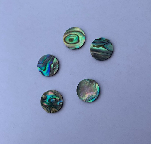 Paua shell discs 18mm (0.7") diameter x 1.3mm (0.05") thickness polished both sides.Round flat shell pcs cut to precise diameter and thickness. Ideal for use in inlay applications, watch dials or jewellery decorations.