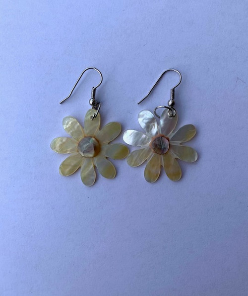 Genuine shell earrings, made from real mother of pearl shells. Beautiful present for a special someone or to spoil yourself. Each set of earrings are handmade.
