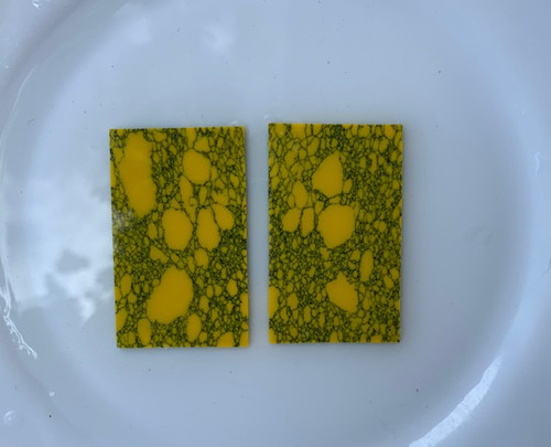 Yellow Stone reconstituted stone blanks 30 x 50 x 1.5mm suitable for inlay. Can be cut with standard cutting tools - jewellery saw similar in characteristics to mother of pearl (hardness approx. 3. Can be sanded and polished same way as shell material. All pcs are A grade good on both sides.