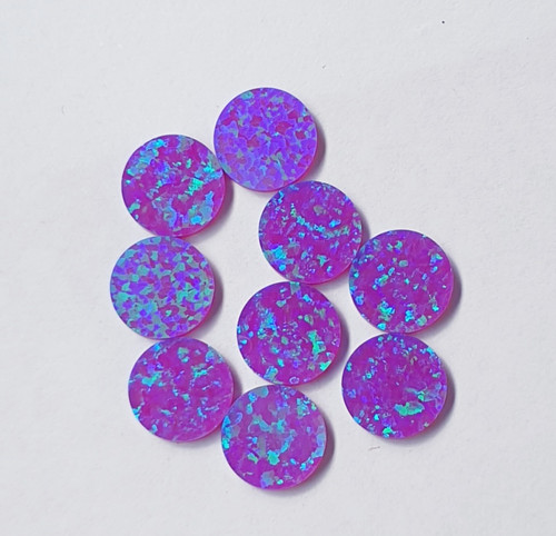 Opal dots OP52 9.5 x 1.3mm flat pcs made to specific diameter and thickness made from manufactured opal suitable for inlay, fingerboard markers, jewellery, Opal dots can be worked same way as mother of pearl and are of similar hardness.