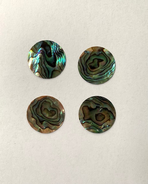 Paua shell discs 29mm (1.14") diameter x 0.5mm (0.02") thickness polished 1 side. Round flat shell pcs cut to precise diameter and thickness. Ideal for use in inlay applications, watch dials or jewellery decorations.