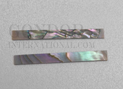 Red abalone solid shell straight strips 6.35mm (1/4") width x 25mm (1") length x 1.5mm (0.06") thickness. A grade quality good on both sides, flat and uniform in thickness and width. Ideal for use in purfling on musical instruments - Ukuleles, guitars, mandolins etc. as well as in furniture, jewellery ans other decorative applications.