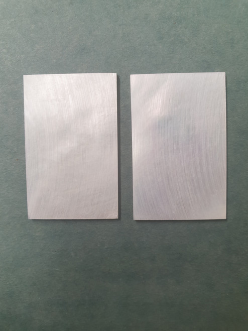 White Mother of Pearl flat, no figure, clear face size 35mm (1.38") width x 50mm (1.97") length x 1.5mm (0.06") thickness A grade good on both sides.
