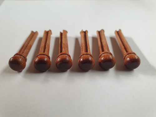 1 set (6pcs) Guitar bridge pins  Australian Rosewood size 1 Tapered shaft string slot running the full length of shaft. Diameter at top of shaft 5.3mm (0.21") length of shaft 22.9mm (0.9") . Will fit the following models - Martin guitars prior to 1994 (except HD-28), Collings guitars, prior to 2002, Blanchard, Garrison, Goodall, Ryan, Santa Cruz, Taylor, Larrivee D-03R and others.
