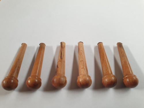 1 set (6pcs) Guitar bridge pins size 2A Apricot. Tapered shaft string slot running the full length of shaft. Diameter at top of shaft 5.6mm (0.22") length of shaft 25.5mm (1") . Will fit the following models - Martin guitars since 1994,as well as D-28 older Gibson guitars,and others.