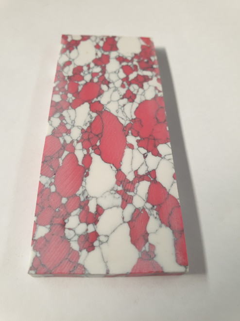 Kakortokite E38 artificial stone blanks 37 x 90 x 4.76mm suitable for inlay, knife handle scales. Can be cut with standard cutting tools - jewellery saw similar in characteristics to mother of pearl (hardness approx. 3. Can be sanded and polished same way as shell material. All pcs are A grade good on both sides.