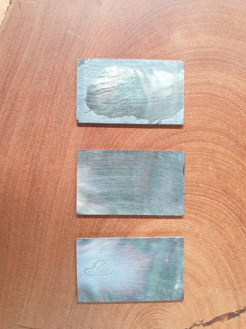 Black Mother of Pearl flat inlay blanks size 30mm (1.18") width x 50mm (1.97") length x 1.5mm (0.06") thickness. May have shell skin on one side.