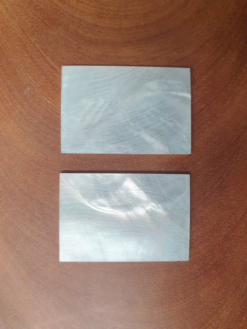 White Mother of Pearl flat inlay blanks size 36mm width x 38mm length x 1.5mm (0.06") thickness. A grade good on both sides.
