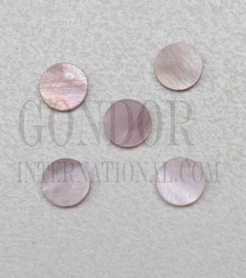 Pink mussel shell dots 7mm diameter x 1.3mm thickness are round flat shell pcs cut to precise diameter and thickness. Ideal for use in inlay applications - for fretboard markers and general inlay or jewellery decorations. All dots are A grade.