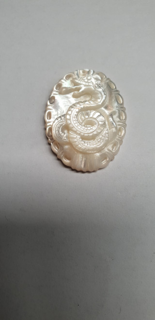 White MOP cabochon Chinese zodiac Snake size width 22.5 x length 30 x thickness 4.5mm Best grade W, MOP carving high quality precision work. Suitable for jewellery and other decorative applications. A grade.