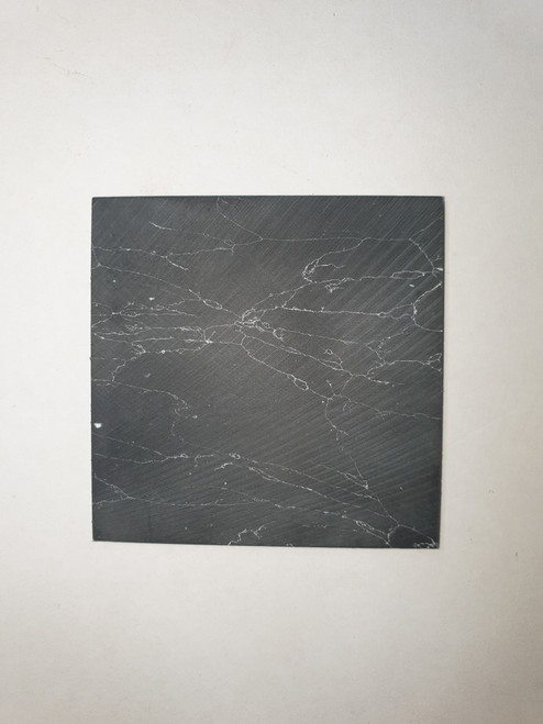 Marble black blanks F050 reconstituted stone blanks 50 x 50 x 2mm suitable for inlay. Can be cut with standard cutting tools - jewellery saw similar in characteristics to mother of pearl (hardness approx. 3. Can be sanded and polished same way as shell material. All pieces are A grade good on both sides.