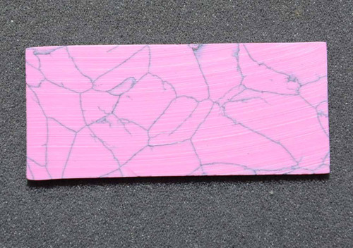 Pink stone I79 artificial stone blanks 30 x 90 x 4.76mm suitable for inlay. Can be cut with standard cutting tools - jewellery saw similar in characteristics to mother of pearl (hardness approx. 3. Can be sanded and polished same way as shell material. All pcs are A grade good on both sides.