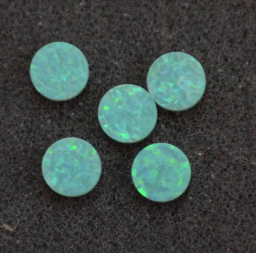 Opal dots OP11 7 x 1.3mm flat pcs made to specific diameter and thickness made from manufactured opal suitable for inlay, fretboard markers, jewellery, Opal dots can be worked same way as mother of pearl and are of similar hardness.