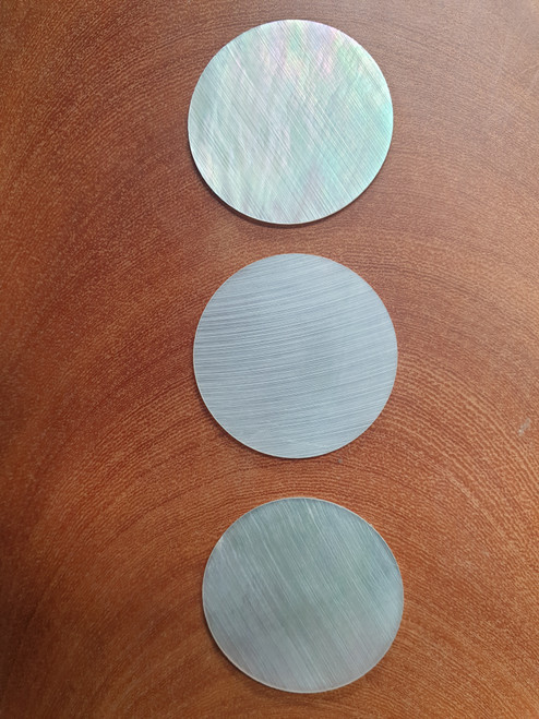 White Mother of Pearl discs 30mm (1.18") diameter x 0.8mm (0.03") thickness. Round flat clear shell pcs cut to precise diameter and thickness. Ideal for watch dials and jewellery decorations. All discs are A grade good on both sides.
