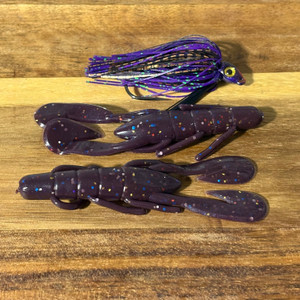 3/8 oz hot purple swim jig and (12) craw trailers