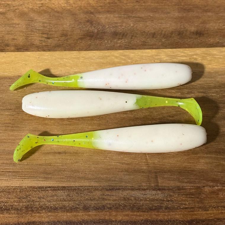 4 inch Blind Squirrel Baits slim shaddy swimbait. Pearl body with a chartreuse color mix tail.