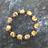 Skull Bracelet of Bone and Hematite, 11 Carved Bone Skulls and 11 Round Hematite Beads, Stretch Cord