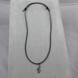 Dark sterling clef on adjustable black leather cord