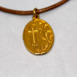 Mary Medal in Gold on Brown Leather