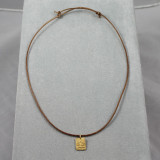 Lotus pendant on leather cord