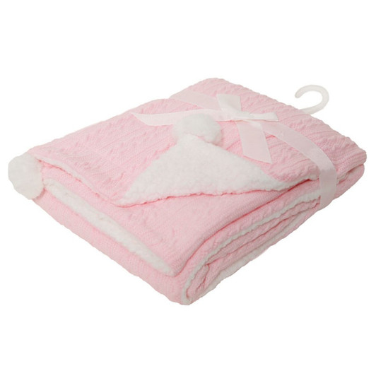 A cosy cable knit wrap in soft PINK , featuring a plush off-white sherpa backing for extra warmth and comfort. Finished with cute pom pom details, it’s perfect for keeping baby snug. Size: 75 x 90 cm. Made from 100% polyester.