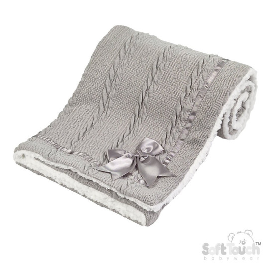 A soft and elegant GREY baby blanket featuring a textured knit design and a plush sherpa-style backing for extra warmth and comfort. Finished with a delicate satin bow, it’s perfect for keeping baby cozy at home or on the go.