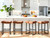 Modern Bar Stools Set of 4 for Kitchen Counter 24 inch Counter Height Backless Barstools with Upholstered Faux Leather Saddle Seat and Metal Frame Industrial Bar Chairs, Brown