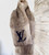 Stay warm in ultimate sophistication with the Beige Brown Louis Vuitton Echarpe Rabbit Fur Muffler Scarf M71968. Louis Vuitton's iconic design meets cozy rabbit fur, making it the perfect winter accessory. Discover luxury today