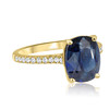 Blue Sapphire on Diamond Pave Band in Yellow Gold Side