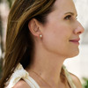 14k yellow gold small studs with 2 LAB GROWN brilliant diamonds, bezel set, totaling 1.15 carats, screw posts - on figure