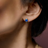14k huggie style earrings with round blue sapphires 1.58cts on model