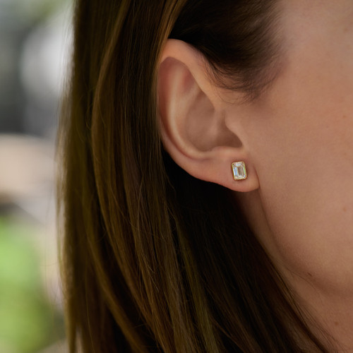 14k yellow gold small studs with 2 LAB GROWN emerald cut diamonds, bezel set, totaling 1.50 carats - on figure