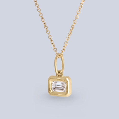 14k yellow gold pendant with a horizontally set LAB GROWN emerald cut diamond 0.85 carats, E/F-VS, side view