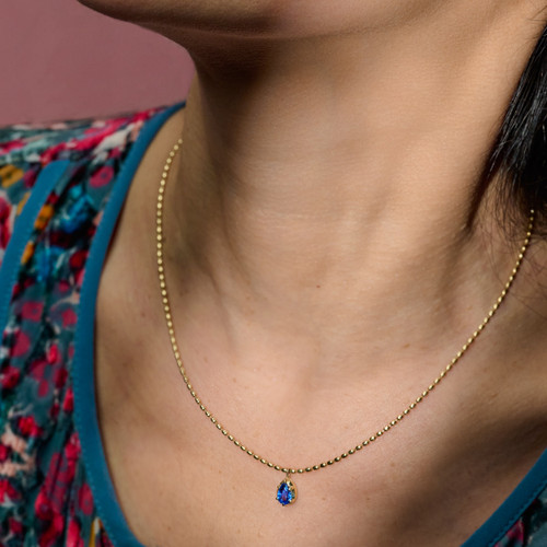 Blue Sapphire Pear Pendant on Ball Chain on model close-up
