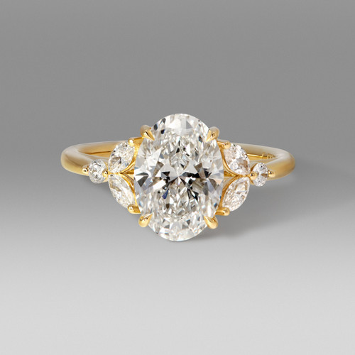 Multi-Stone Diamond Custom Engagement Ring with Oval Cut center flanked by one round and two marquise diamonds on each side