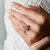 Champagne Marquise Diamond Engagement Ring with side diamonds on hand model