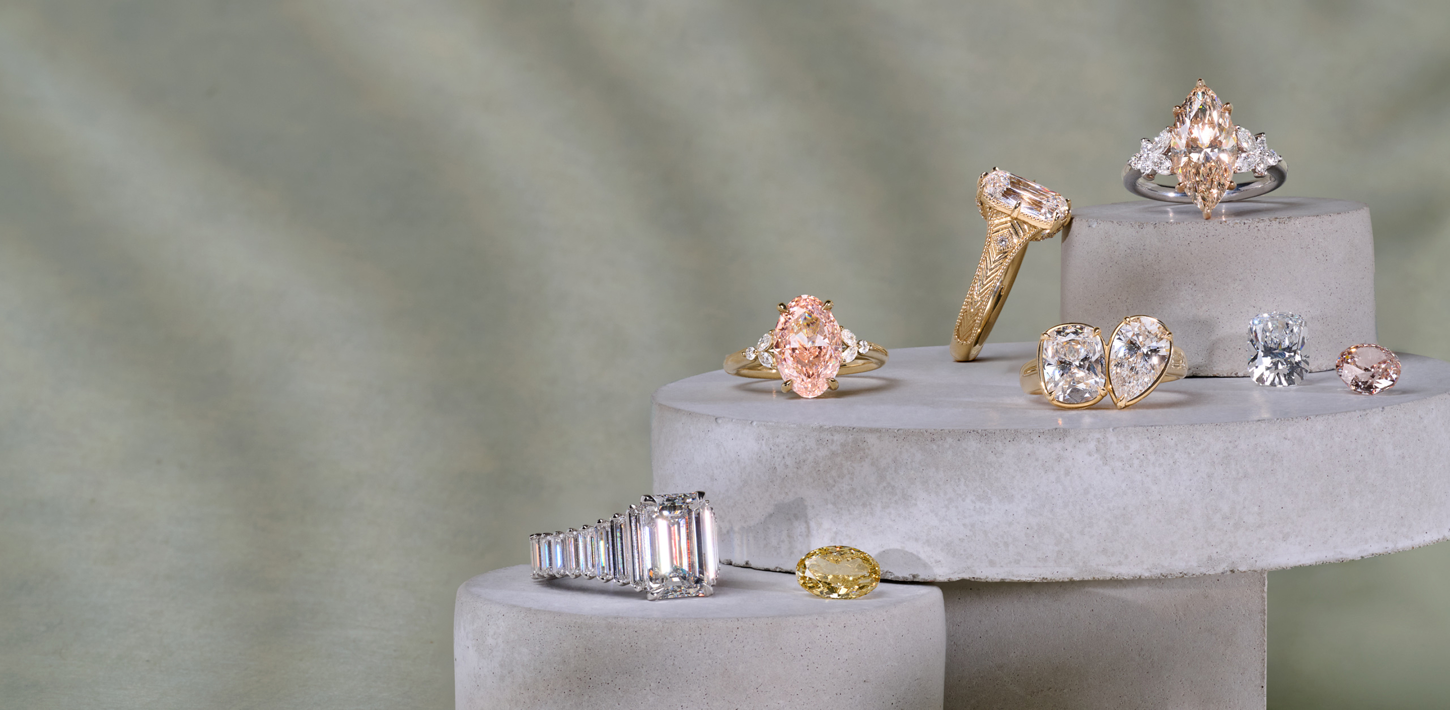 Collage of natural and lab grown diamond engagement rings and loose diamonds