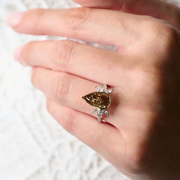 Pear champagne desert diamond engagement ring on hand