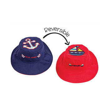 It will be smooth sailing for a little captain wearing this durable and reversible nautical themed bucket hat.

This reversible kids sun hat features a beautifully embroidered anchor on one side and a sailboat on the other.

Begin the expedition in Navigating Navy, turn the tide and flip over this reversible hat to go on a Vermillion Voyage.

Our reversible kids sun hats are made with 100% cotton, have a clever embroidered saying on the front as indicated and reversible chin straps for small and medium sizes. UPF 50+ sun protection.